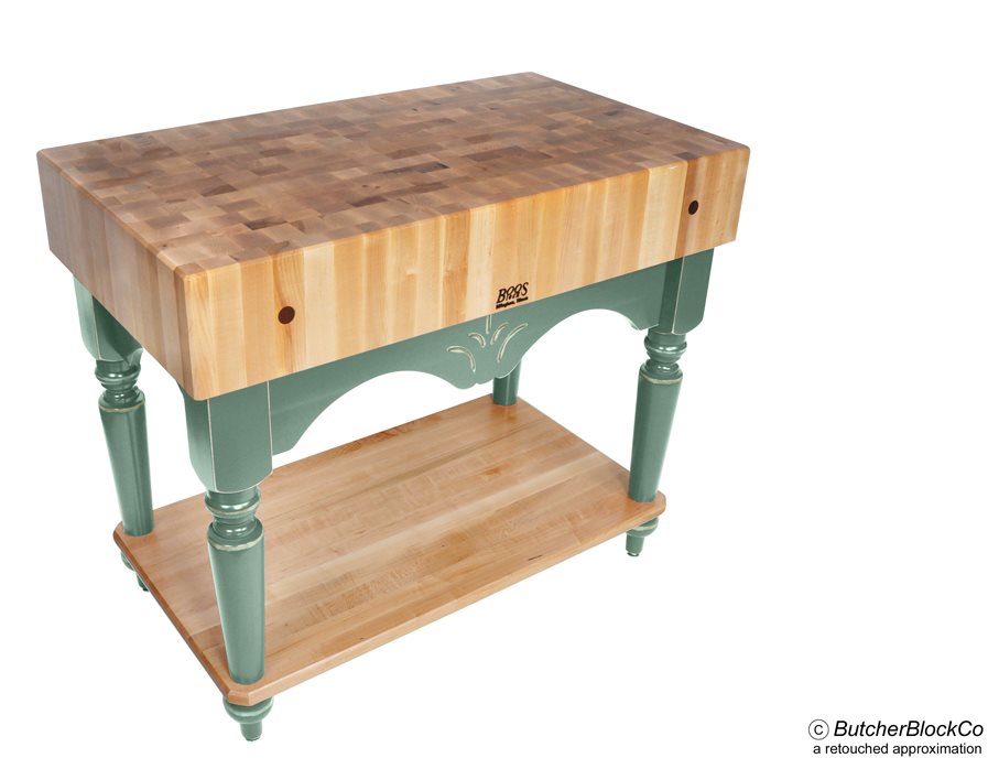 End-grain butcher block table with a light top and sage green painted base with turned legs